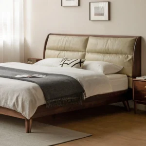 Black walnut bed frame with cream leather pillow headboard beside a matching nightstand
