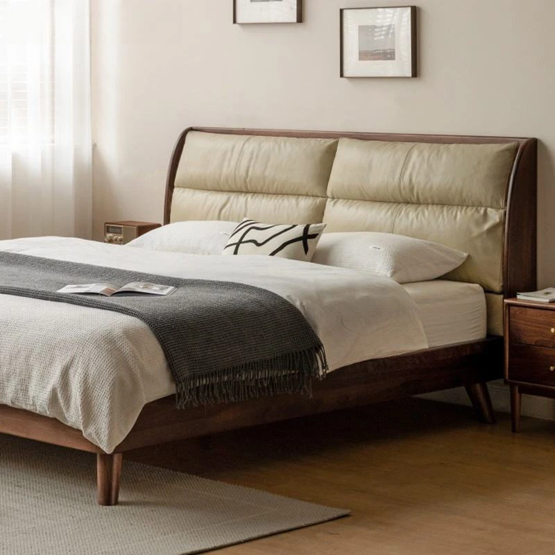 black-walnut-bed-frame-side-view-with-nightstand Black walnut bed frame with cream leather pillow headboard beside a matching nightstand