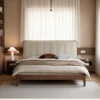 Black walnut bed with channel tufted headboard in a cozy reading lifestyle scene