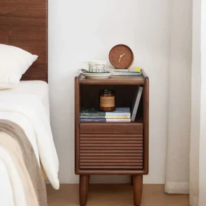 Black walnut fluted drawer nightstand in a warm modern bedroom scene