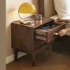 Black walnut nightstand side view with drawer open showing slide rail