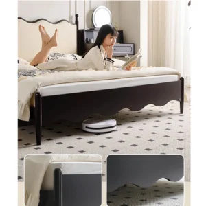 Black wood upholstered bed with cream wavy headboard in a cozy lifestyle reading scene