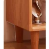 Cherry open nightstand with books and decor in a bedroom storage scene