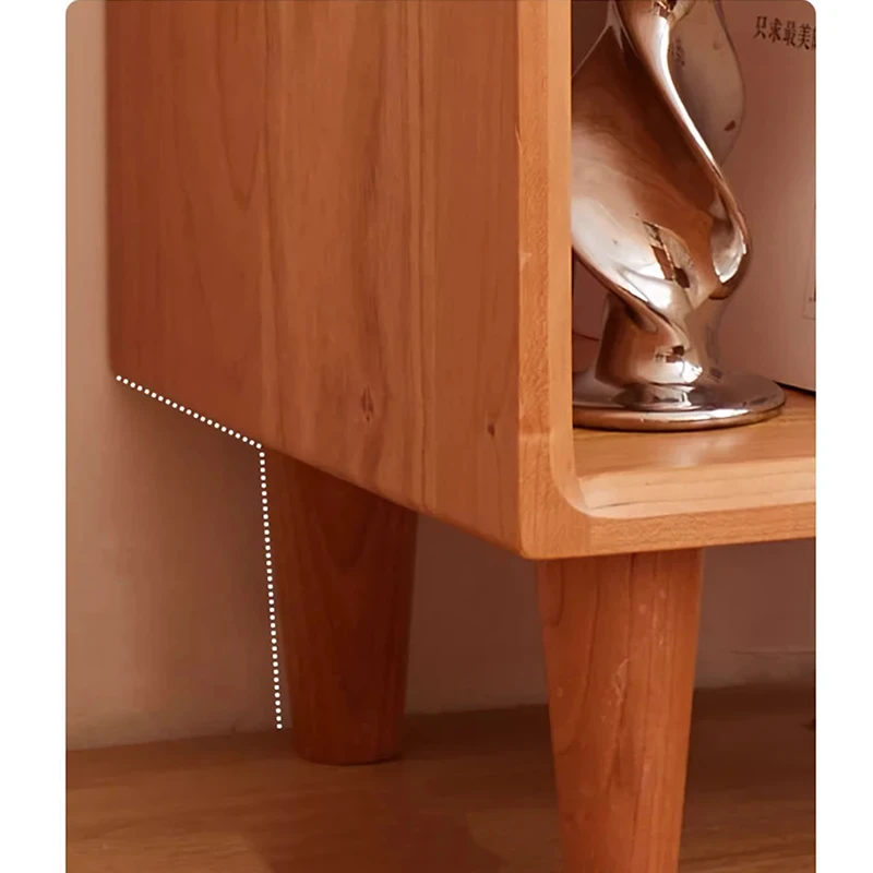 Cherry open nightstand with books and decor in a bedroom storage scene