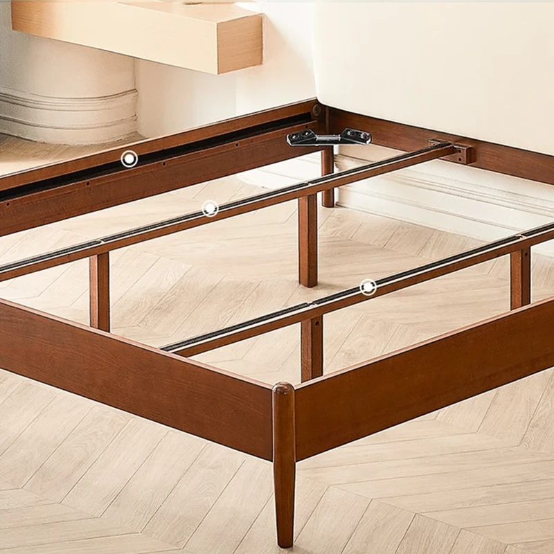 Cherry wood bed frame support structure detail showing center rail and legs