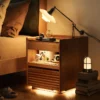 Cherry wood nightstand with built-in LED light glowing in a night bedroom scene