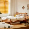 Cherry wood platform bed with spindle headboard in a cozy lifestyle bedroom scene