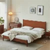cherry-wood-platform-bed-vanity-desk-bedroom-scene Cherry wood platform bed with matching vanity desk in a warm bedroom scene