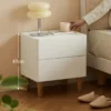 Cream white nightstand beside a bed in a bedroom scene with 47cm height mark