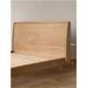 Natural ash platform bed front view in a bright bedroom scene