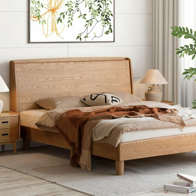 Natural ash wood platform bed frame with tall headboard in a master bedroom