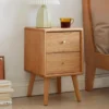 Natural oak 2 drawer nightstand bedside table with lamp in bedroom