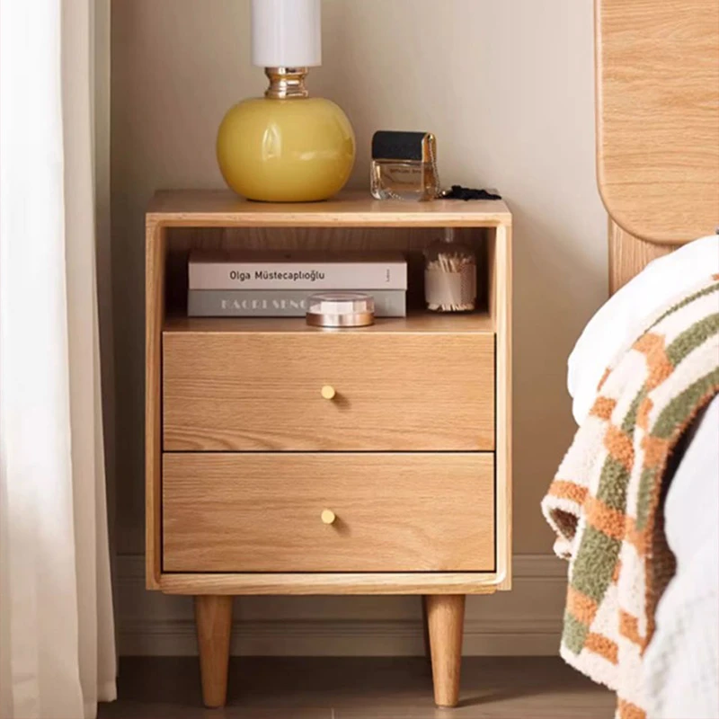 natural-oak-2-drawer-nightstand-open-shelf-bedroom Natural oak two-drawer nightstand with an open shelf beside a bed