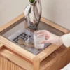 Natural oak nightstand fluted drawer and glass top close-up detail
