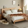 Natural oak platform bed with curved headboard storage product front view