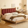 oak-bed-arch-upholstered-headboard-red-bedroom Oak bed with arch upholstered headboard in a bold red bedroom