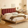 oak-bed-burgundy-upholstered-headboard-scene Oak upholstered bed with burgundy headboard in a warm lifestyle bedroom scene