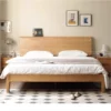 oak-bed-frame-bedroom-lifestyle-scene Oak bed frame in a bedroom lifestyle scene with natural bedding