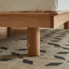 Oak bed frame round solid wood leg detail showing a smooth rounded finish