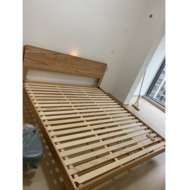 oak-bed-frame-slatted-base-close-up Oak bed frame slatted base close-up showing evenly spaced wood slats