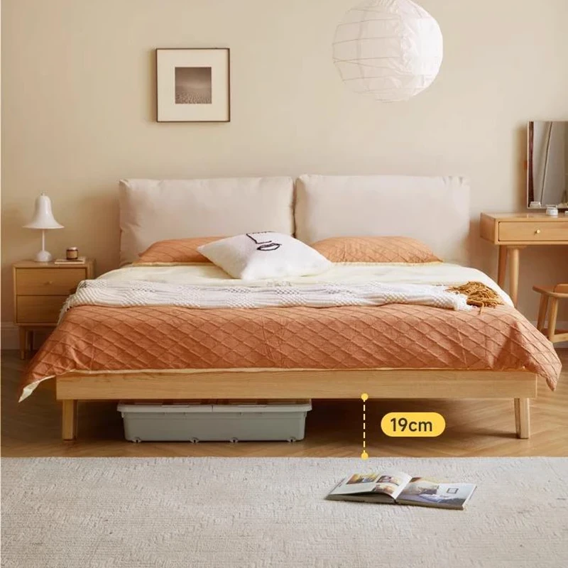 Oak bed removable headboard showing open underbed storage space