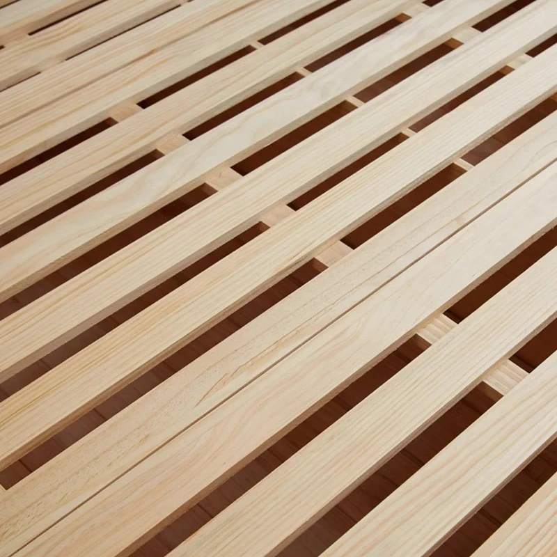 oak-bed-slatted-base-wood-grain-texture Oak bed slatted base with visible wood grain texture close up