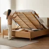 oak-gas-lift-bed-lifted-slatted-base-storage Oak gas lift bed lifted to reveal slatted base and hidden storage compartment