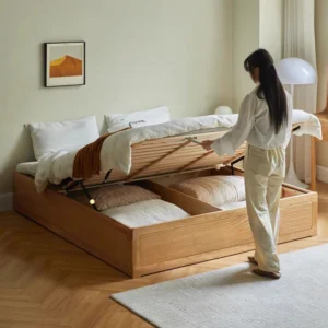 Oak gas lift bed with under-bed storage opened in a cozy bedroom lifestyle scene