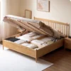 Oak gas lift bed lifted open showing the underbed storage space