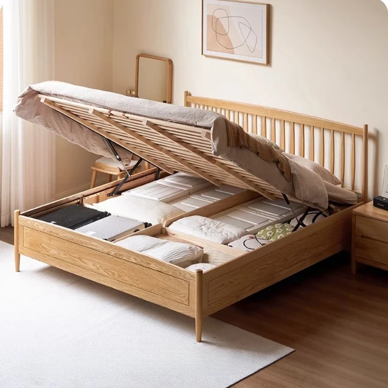 Oak gas lift bed lifted open showing the underbed storage space