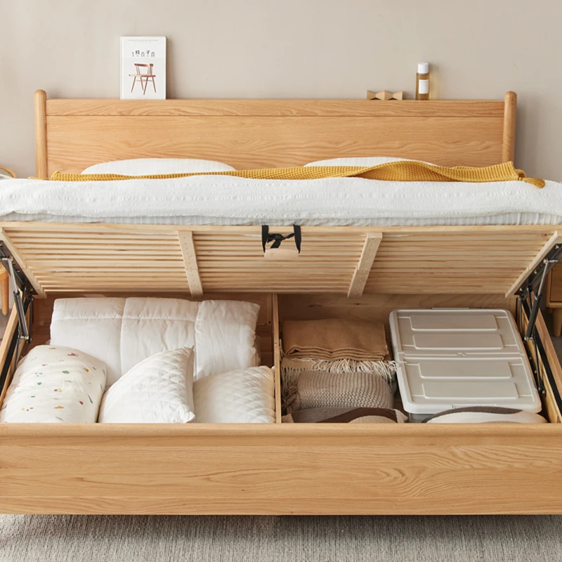 Oak gas lift storage bed opened from the front showing roomy storage space