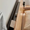 Oak headboard with built-in USB charging port and storage shelf detail