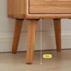 Oak nightstand drawer with round brass knob close up detail view