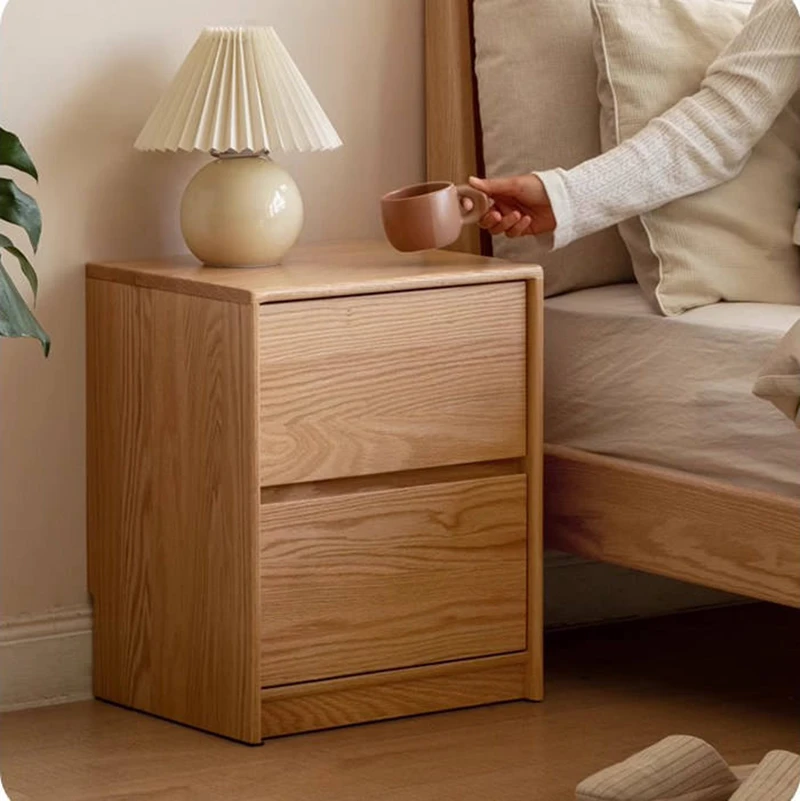 oak-nightstand-lifestyle-scene-bedside-tea Oak two-drawer nightstand beside the bed with a hand reaching for tea