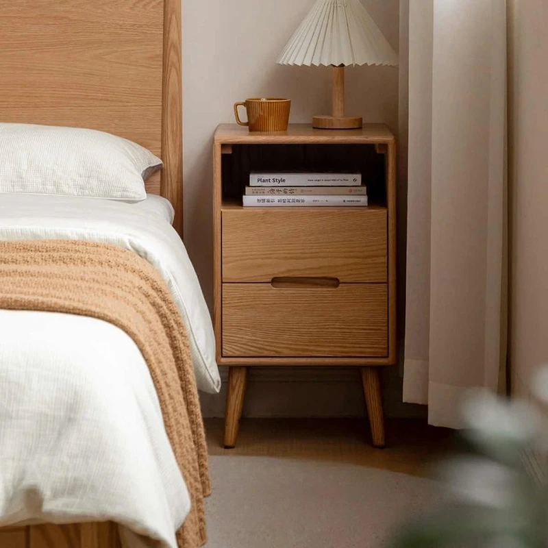 oak-nightstand-open-shelf-bedroom-lifestyle-scene Oak nightstand with open shelf beside a bed in a warm lifestyle bedroom scene