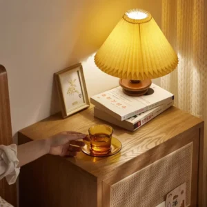 oak-nightstand-rattan-door-bedroom-lifestyle-scene Oak rattan nightstand beside a bed in a warm bedroom lifestyle scene