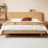 oak-platform-bed-floating-headboard-bedroom Oak platform bed with floating headboard in a calm modern bedroom scene
