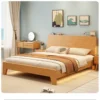 Natural oak platform bed with sloped headboard in a styled master bedroom scene