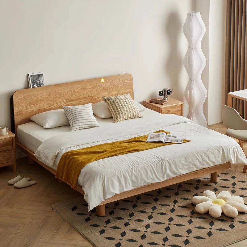 Oak platform bed with rounded headboard in a master bedroom lifestyle scene