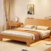 oak-platform-bed-sloped-headboard-side-view Oak platform bed sloped headboard side view showing low profile frame