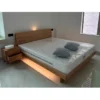 oak-platform-bed-with-nightstand-ambient-light Oak platform bed with nightstand under soft ambient bedroom lighting