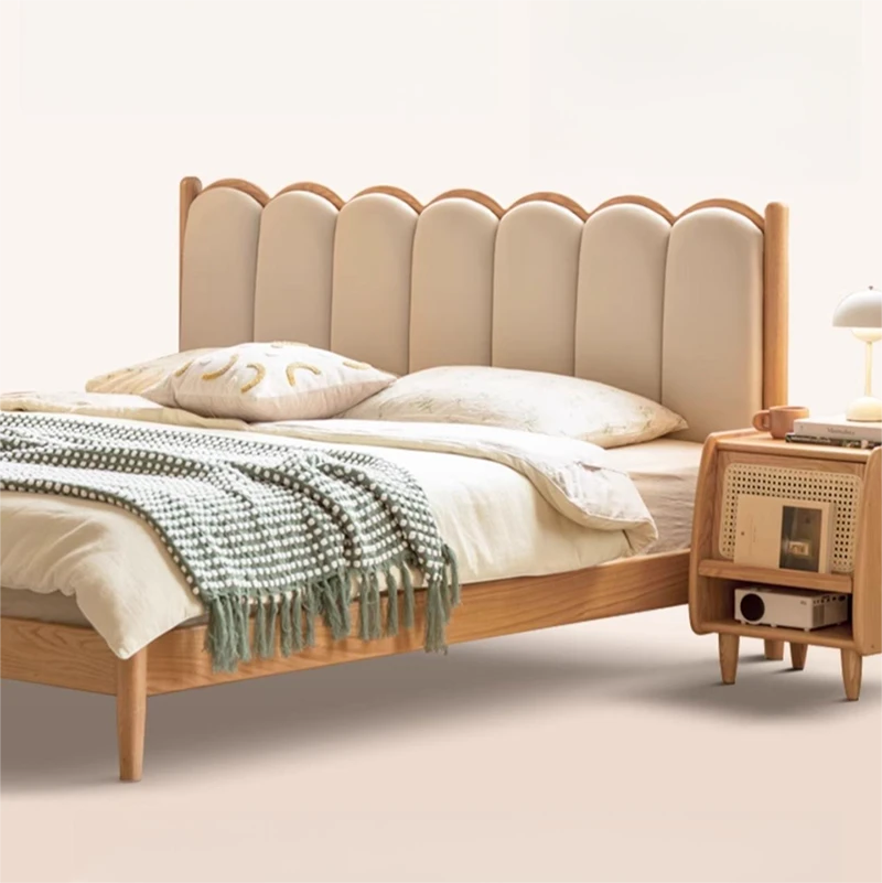 Oak scalloped headboard bed side view showing slim solid wood frame