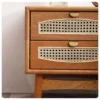 Rattan cane drawer with brass pull and cherry wood grain detail