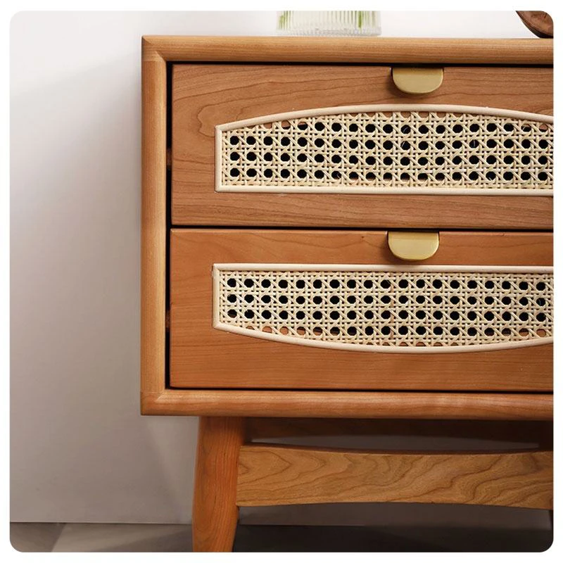 Rattan cane drawer with brass pull and cherry wood grain detail
