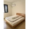 solid-oak-platform-bed-frame-master-bedroom Solid oak platform bed frame in a master bedroom with warm ambient lighting