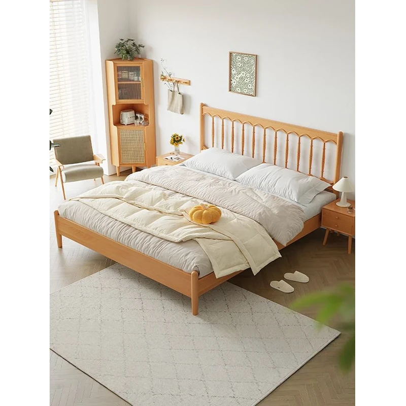 Cherry wood platform bed with spindle headboard in a bright japandi bedroom scene