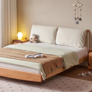 solid-wood-platform-bed-fabric-headboard-bedroom Solid wood platform bed with cream fabric headboard in a warm bedroom scene