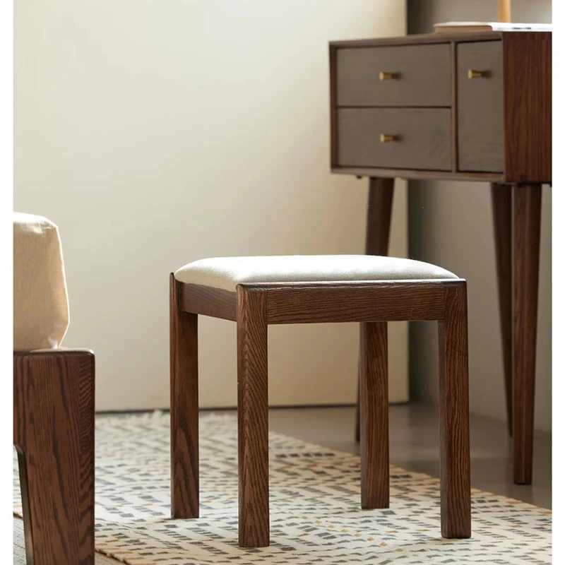 Solid wood vanity stool with cushioned seat and tapered legs