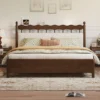 Walnut bed frame with cream headboard front view in a simple bedroom setting