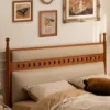walnut-bed-frame-upholstered-headboard-carved-holes-detail Walnut bed frame upholstered headboard carved hole detail close up